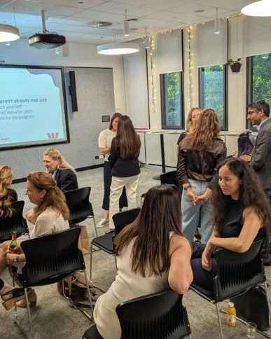 Women learning together at a Tech Ready Women AI workshop