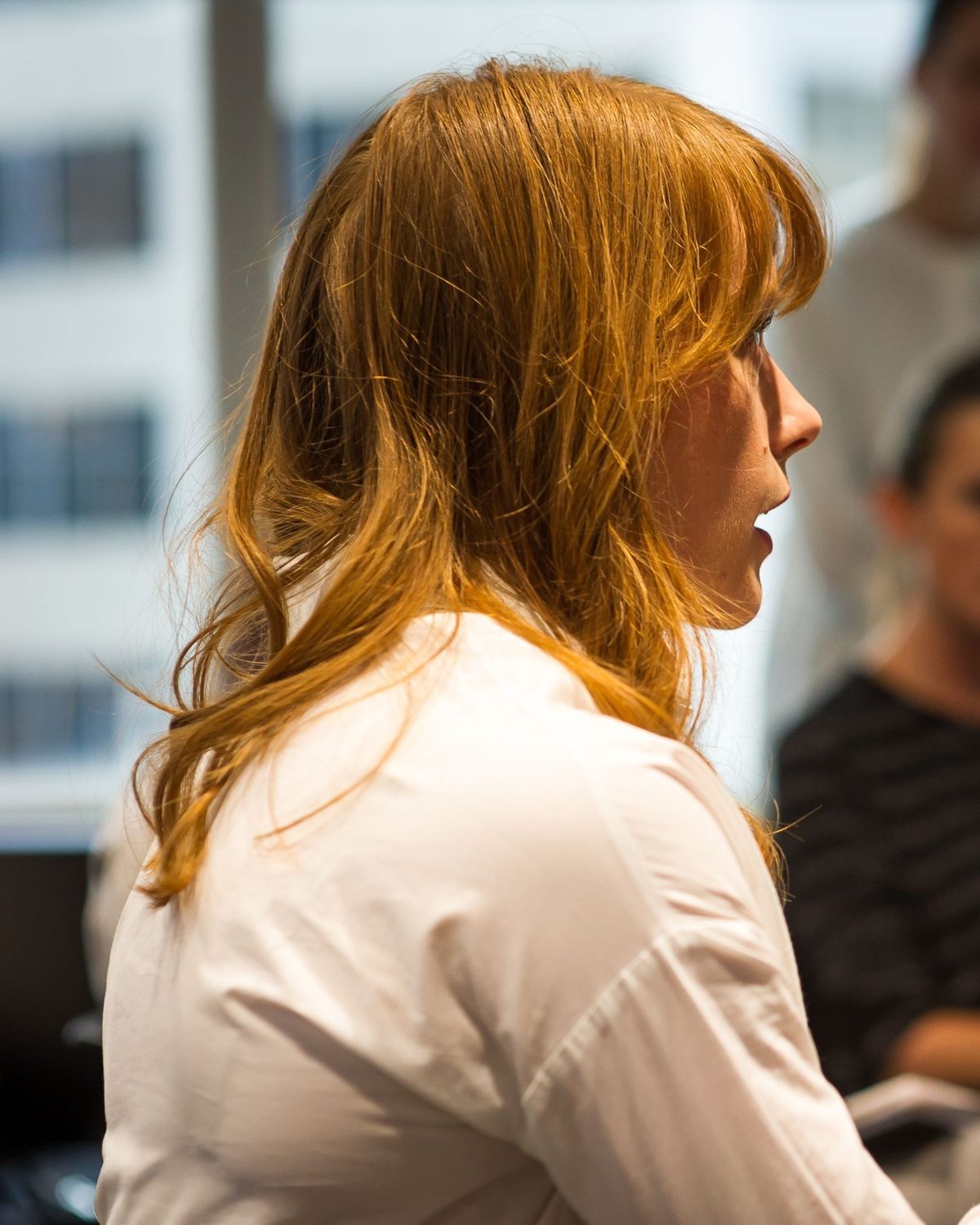 A woman speaking at a TRW event